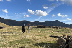 Jake reaching out to one of the villagers.