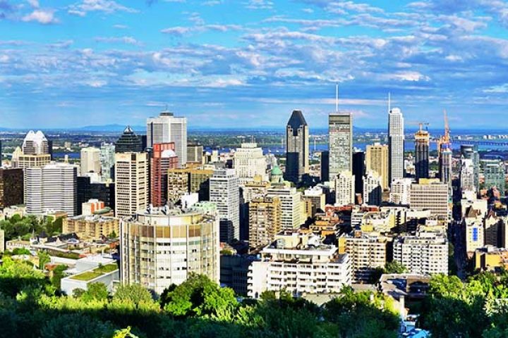 Scenic panorama of the city of Montreal in Quebec from the Chalet du Mont Royal (Mount Royal Chalet) belvedere viewpoint.
